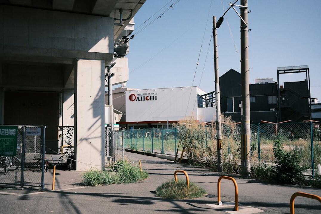 Satellite broadcast truck with a raised uplink dish outside a venue